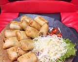 A picture of step 4 of Chicken and King Oyster Mushroom Spring Rolls with Vegetables.