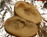 Foto del paso 2 de la receta: Patata asada, rellena de filetes de pollo al ajillo y perejil