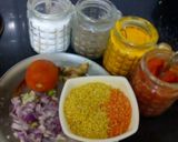 A picture of step 1 of Punjabi dal tadka with salad and roti.