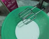 A picture of step 2 of Vanilla cream cake with chocolate chips inside.