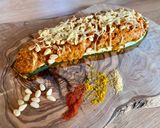 Une image de l'étape 8 de Courgettes farcies au quinoa, parmesan et pignons.