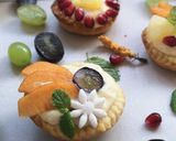 A picture of step 12 of Custard fruit puff tart.