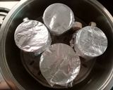 A picture of step 3 of Bhapa Doi Steamed yoghurt pudding.