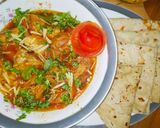 A picture of step 4 of Chicken Karahi with chapati and mango shake.