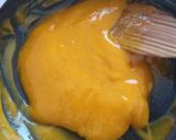 A picture of step 8 of Baked Mango Doughnuts with Mango Glaze.