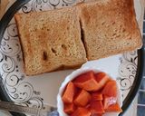 A picture of step 2 of Bread sandwich and ripe papaya.