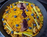 A picture of step 12 of Duck Breast Paella with Cranberries.
