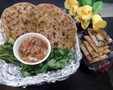 A picture of step 9 of Stuffed paneer paratha with tomato onion chutney.