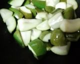 A picture of step 1 of Achari Raw mango.
