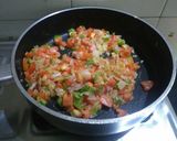 A picture of step 2 of Paneer bhurji (gravy form) with bun.