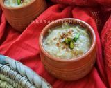 A picture of step 9 of Nolen gurer payesh or Rice kheer with date palm jaggery.