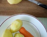 A picture of step 2 of Spiral potato and carrots on stick.