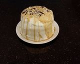 A picture of step 24 of Mocha Layer Cake with Whipped Mascarpone Cream and a Coffee Glaze Drizzle.