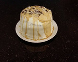 A picture of step 24 of Mocha Layer Cake with Whipped Mascarpone Cream and a Coffee Glaze Drizzle.