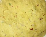 A picture of step 6 of Besni masala prahta with tomato souce.