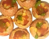 A picture of step 7 of Indian snack (crisp sphere with flavoured water/curd mixture).