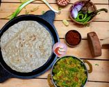 A picture of step 4 of Jawar Bhakri with Baingan Bharta.