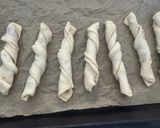 A picture of step 6 of Puff Pastry Twists with 'Nduja Spread, Speck, and Ragusano Cheese.