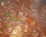 A picture of step 4 of Kibda (Egyptian liver sauce) and French fries.