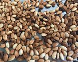Foto del paso 4 de la receta: Almendras tostadas al merkén, ajo y hierbas