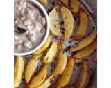 A picture of step 9 of Baked Spiced potato wedges with garlic Bechamel sauce.