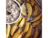 A picture of step 9 of Baked Spiced potato wedges with garlic Bechamel sauce.
