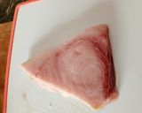 A picture of step 1 of Swordfish Carpaccio with Arugula and Pomegranate Seeds.