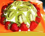 A picture of step 9 of Lemon cake pudding with upside down kiwi whipped cream frosting.