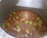 A picture of step 7 of Lauki aloo curry or lauki aloo rassewala.