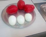 A picture of step 3 of Boiled eggs in tomato sauce.