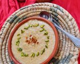 A picture of step 9 of Nolen gurer payesh or Rice kheer with date palm jaggery.