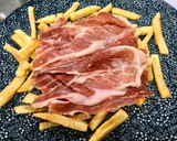Foto del paso 4 de la receta: Huevos rotos con trufa negra y jamón ibérico