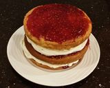 A picture of step 21 of Vanilla Lemon Raspberry Layer Cake with Whipped Cream Buttercream Frosting.