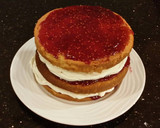 A picture of step 21 of Vanilla Lemon Raspberry Layer Cake with Whipped Cream Buttercream Frosting.