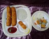 A picture of step 22 of Tandoori chicken rolls up.