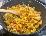 A picture of step 12 of Chicken and Bacon with Peppers, Tomatoes, Spices, and Coconut Milk.