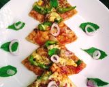 A picture of step 4 of Roti pizza(leftover chapati).
