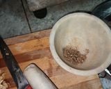 A picture of step 20 of Dodha Burfi with Daliya.