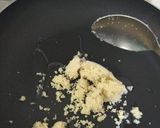 A picture of step 1 of Coconut Mawa balls immersed in Creamy Coconut saffron milk.