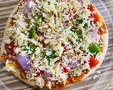 A picture of step 5 of Pizza with readymade Pizzabase.
