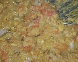 A picture of step 5 of Dam allu with colourful zeera rice.