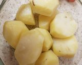 A picture of step 3 of Parmesan smashed Roast Potatoes.
