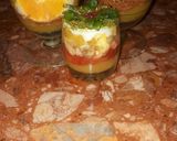 A picture of step 8 of Kunafa and Qashtalia Decorated with Oranges, Strawberries, and Bananas.