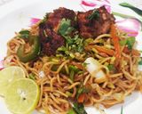 A picture of step 6 of Peri peri noodles with pan fried chicken.
