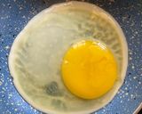 A picture of step 4 of Olive oil fried egg and hummus toast.