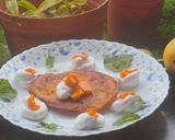 A picture of step 6 of Mango malpua with fresh cream.