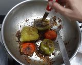 A picture of step 18 of Stuffed capsicums and tomatoes.