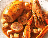 Foto del paso 12 de la receta: Calamar relleno de sus tentáculos, aletas y Cigala