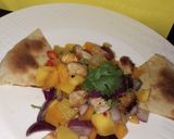 A picture of step 3 of Mango pineapple salad with tortilla.
