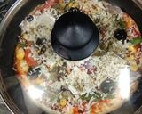 A picture of step 5 of Cheesy paneer pizza.